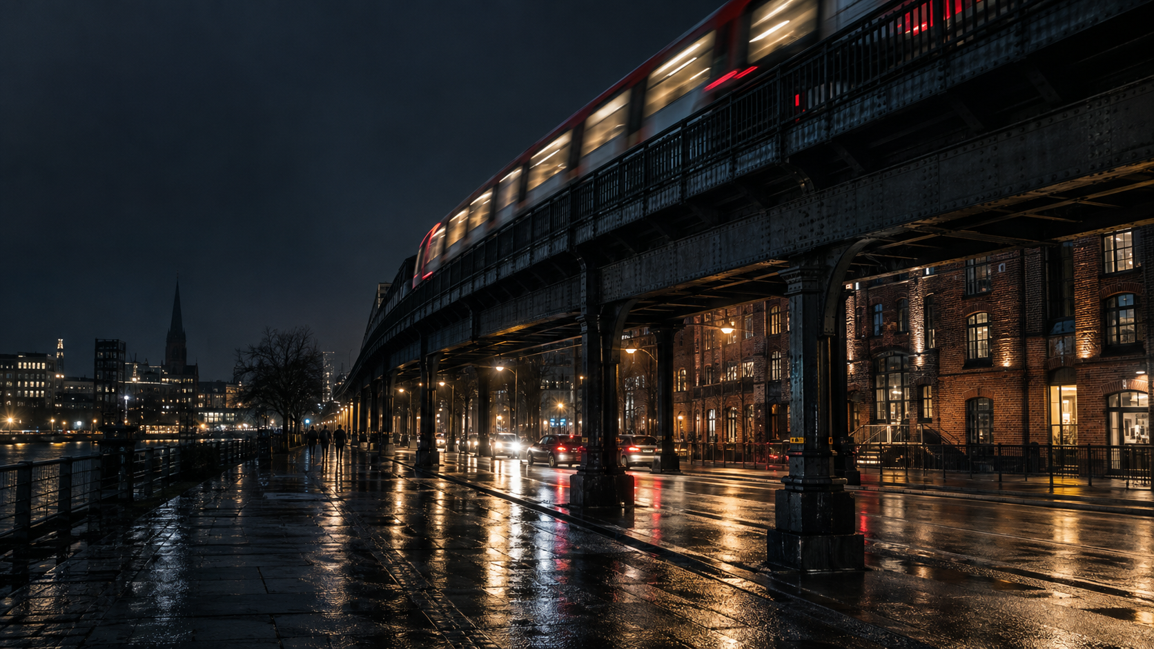Hochbahn und regennasse Straße in Hamburg bei Nacht